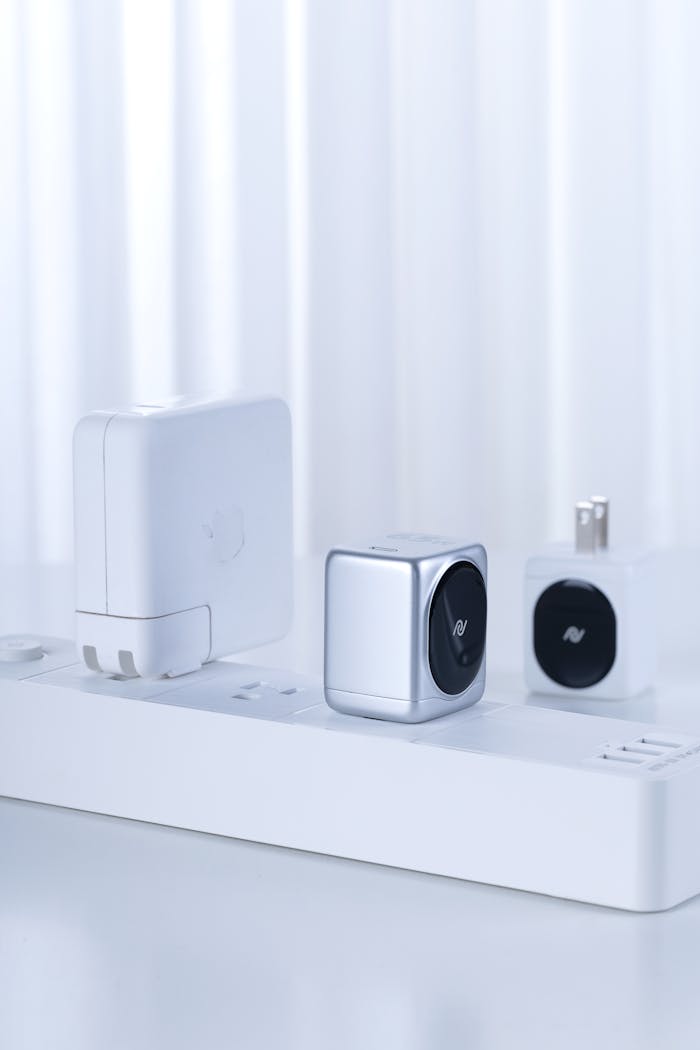 gallery-05 Sleek design of chargers and adapter cubes on a power strip against a white background.